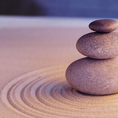 Stones on sand, japanese meditation zen garden close up
